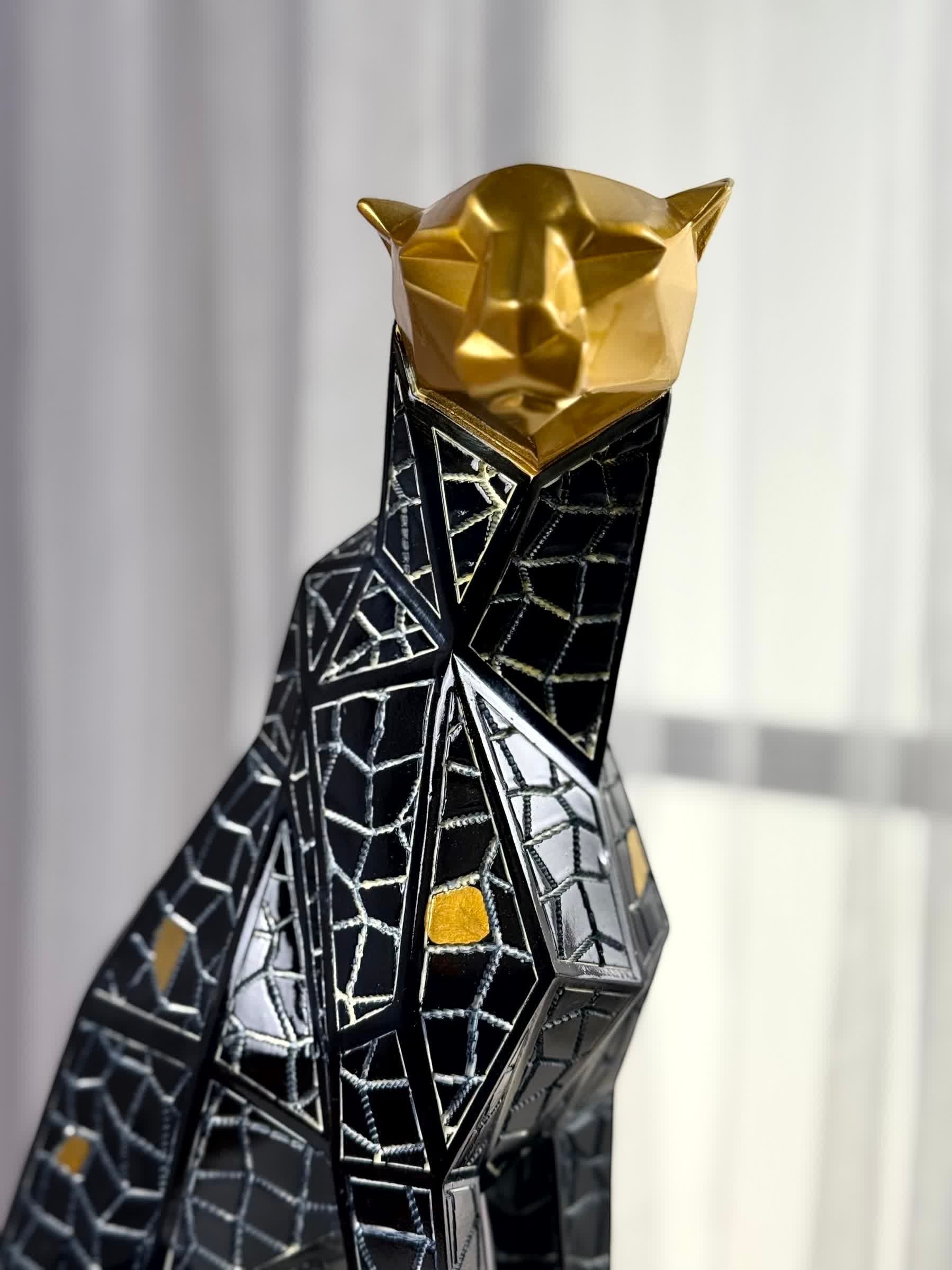High Objects abstract panther showpiece with gold geometric head and black mosaic body, symbolizing strength.
