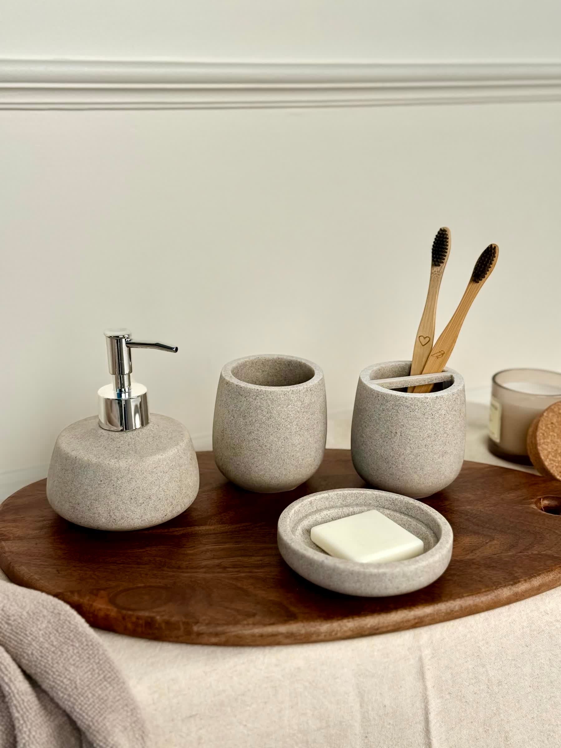 High Objects Pebbleease Bathroom Accessory Set: speckled grey soap dispenser, toothbrush holder, tumbler, and soap dish.