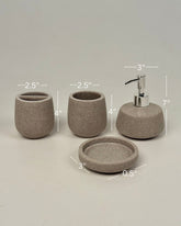 High Objects Pebbleease Bathroom Accessory Set in speckled taupe resin. Includes soap dispenser, toothbrush holder, cup, and dish.