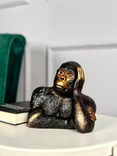 High Objects Pensive Gorilla showpiece sculpture with a golden face and black textured body, resting head on hand.