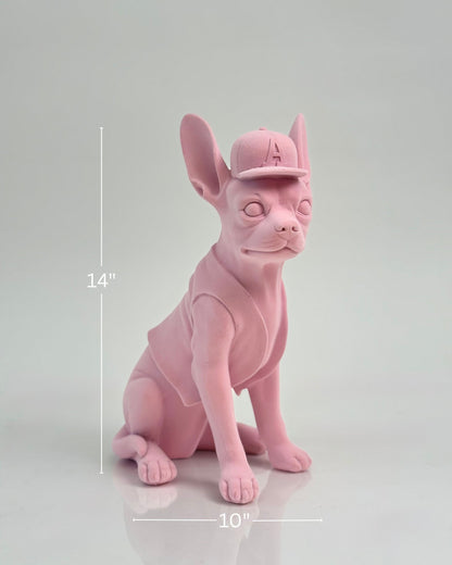 High Objects matte pink French bulldog sculpture wearing a baseball cap and vest.