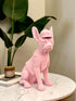 High Objects matte pink French bulldog sculpture wearing a baseball cap and vest. Modern decor accent.