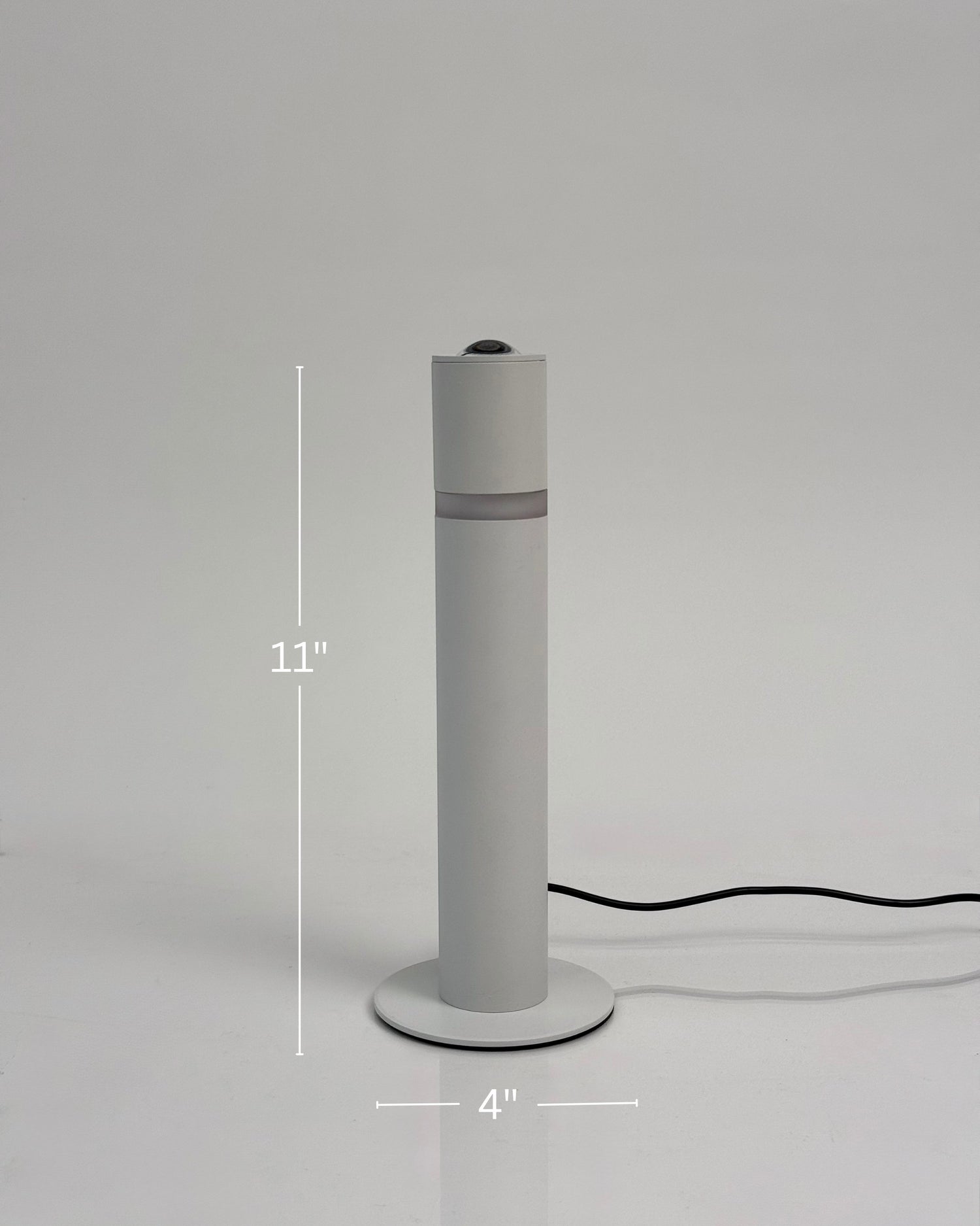 High Objects Pureline white cylindrical table lamp with a subtle mid-band detail, 11" tall.