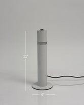 High Objects Pureline white cylindrical table lamp with a subtle mid-band detail, 11" tall.