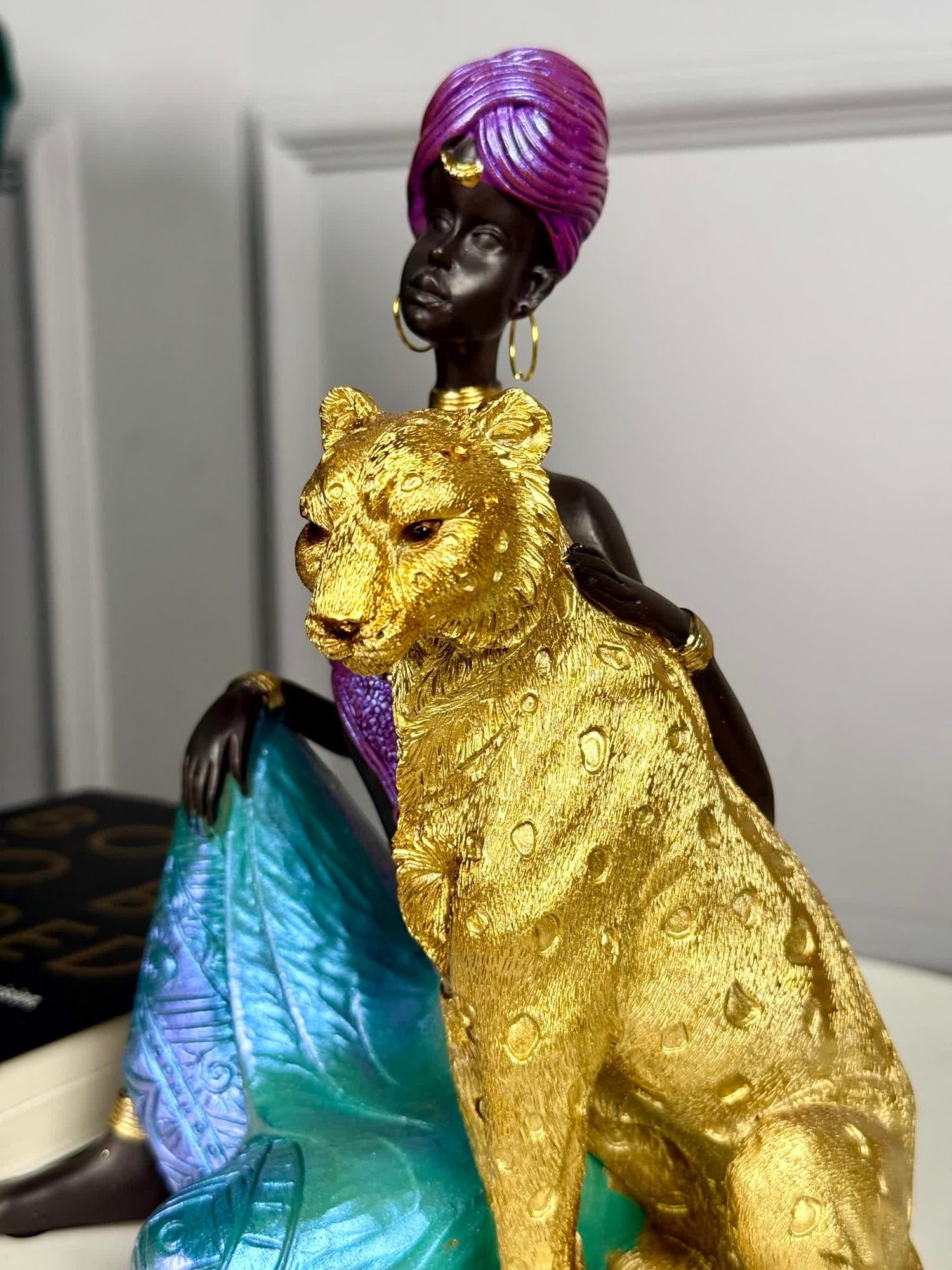 High Objects Queen of the Wild showpiece: African woman in purple turban &amp; teal dress with golden leopard sculpture.