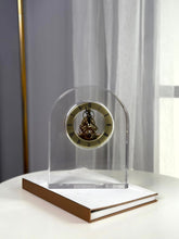 High Objects Regal Crystal Desk Clock with gold-tone detailing and exposed gears. Arched silhouette.