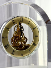 High Objects Regal Crystal Desk Clock with gold Roman numerals and exposed gears. Polished crystal arched silhouette.