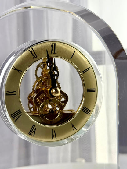 High Objects Regal Crystal Desk Clock with gold Roman numerals and exposed gears. Polished crystal arched silhouette.