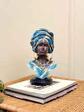 High Objects Regal Essence Woman Showpiece bust with blue patterned headwrap and gold jewelry.