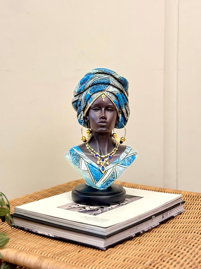 High Objects Regal Essence Woman Showpiece bust with blue patterned headwrap and gold jewelry.
