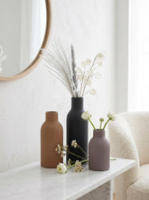 High Objects set of 3 ribbed ceramic vases in brown, black, and grey.