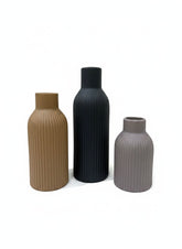 High Objects set of 3 ribbed ceramic vases in tan, black, and grey. Modern decorative home accent.