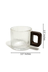 High Objects ORBITO glass cup with ribbed texture and dark geometric handle, 3.5" W x 2.5" H.