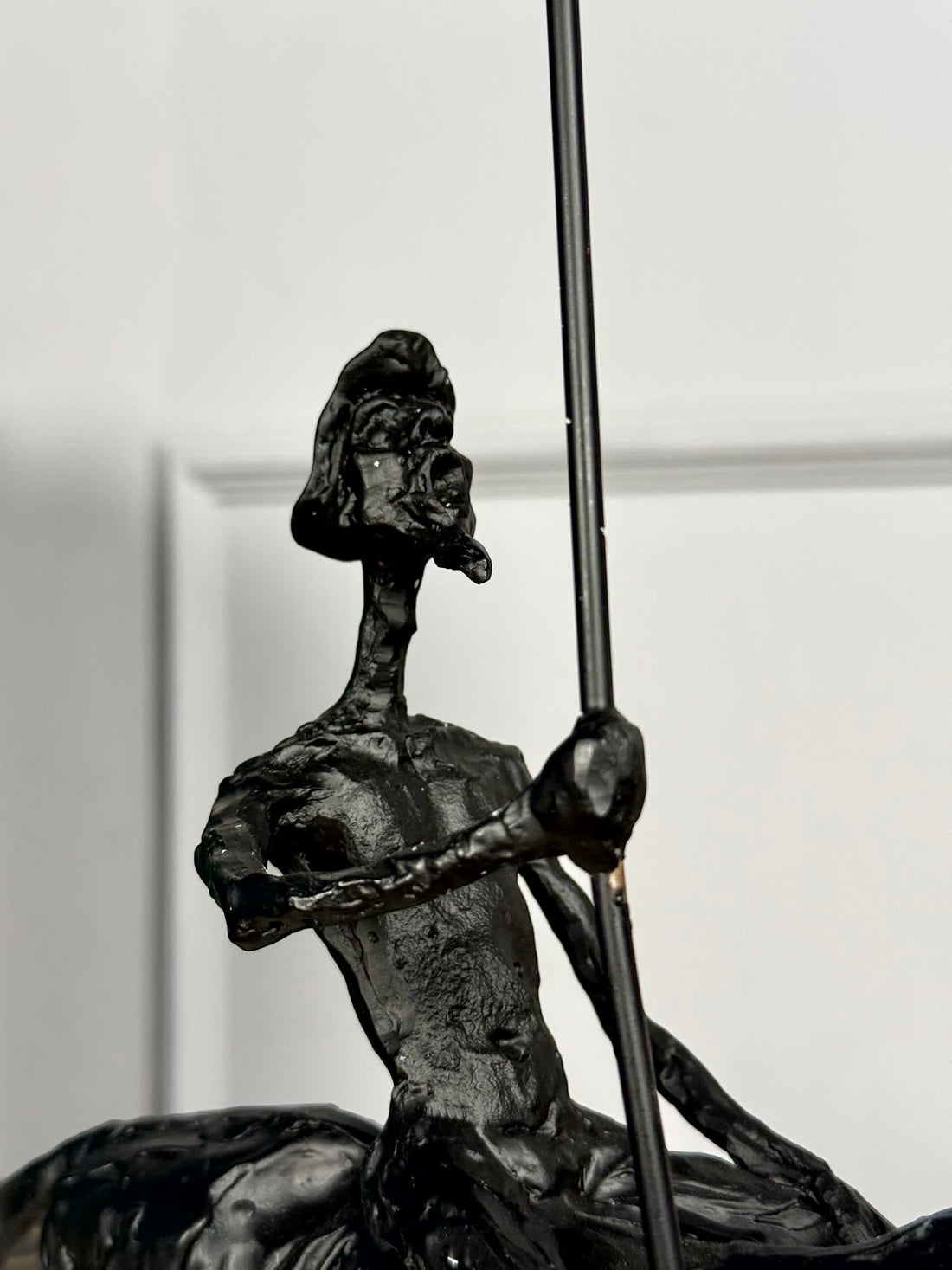 High Objects abstract black-bronze rider sculpture with spear, 17" H x 16" W, textured finish.