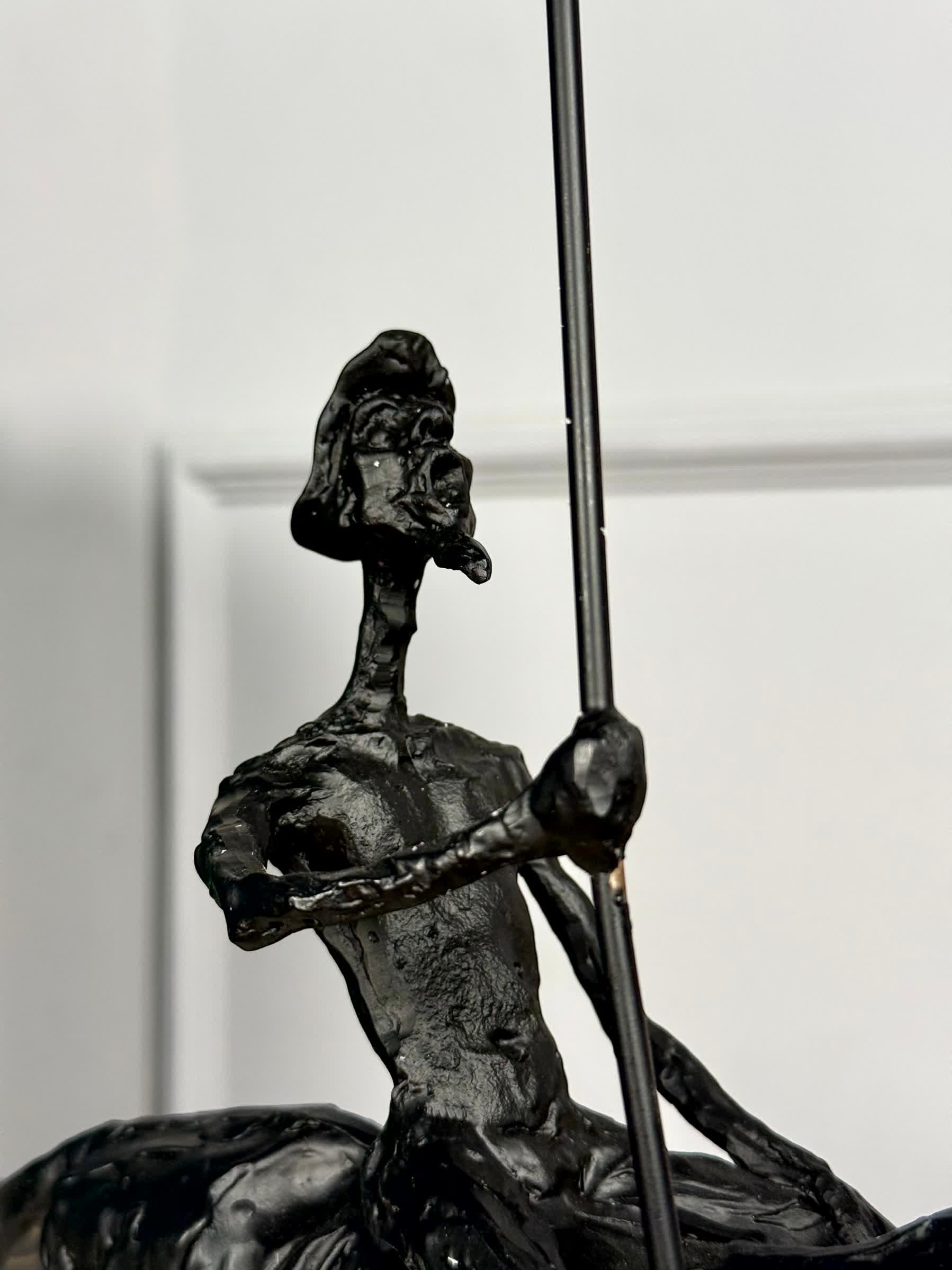 High Objects abstract black-bronze rider sculpture with spear, 17" H x 16" W, textured finish.