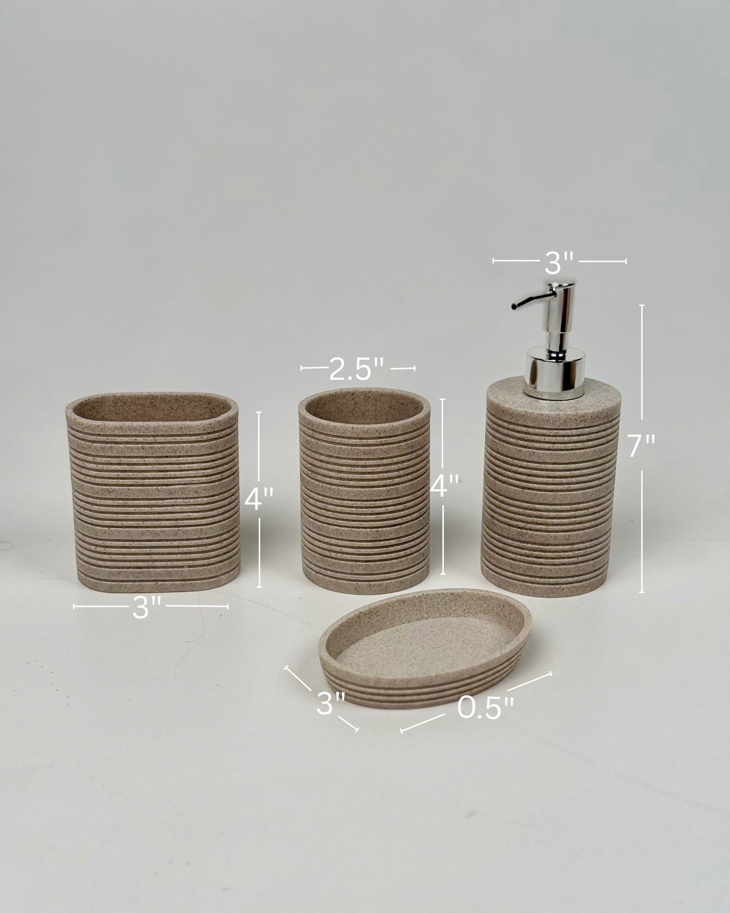 High Objects Ridgeline bathroom accessory set in speckled beige with horizontal ridges. Includes soap dispenser, toothbrush holder, and soap dish.