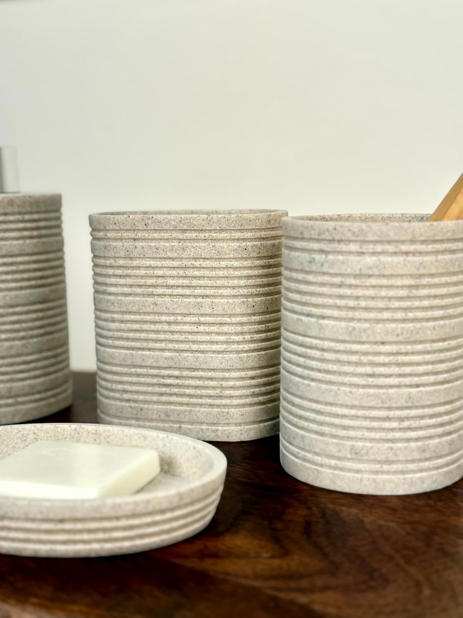High Objects Ridgeline Bathroom Accessory Set in speckled stone with horizontal ridges. Includes soap dish and tumblers.