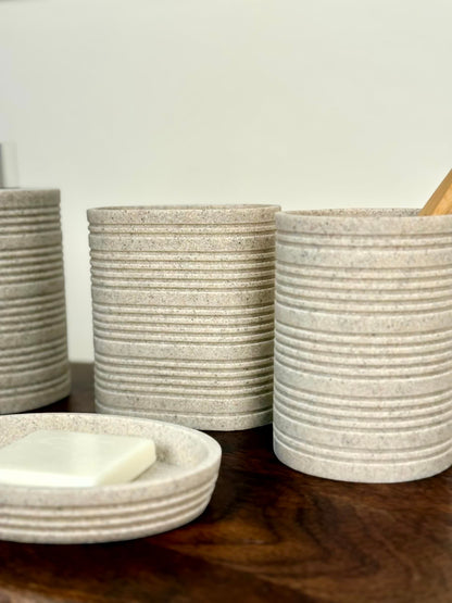 High Objects Ridgeline Bathroom Accessory Set in speckled stone with horizontal ridges. Includes soap dish and tumblers.