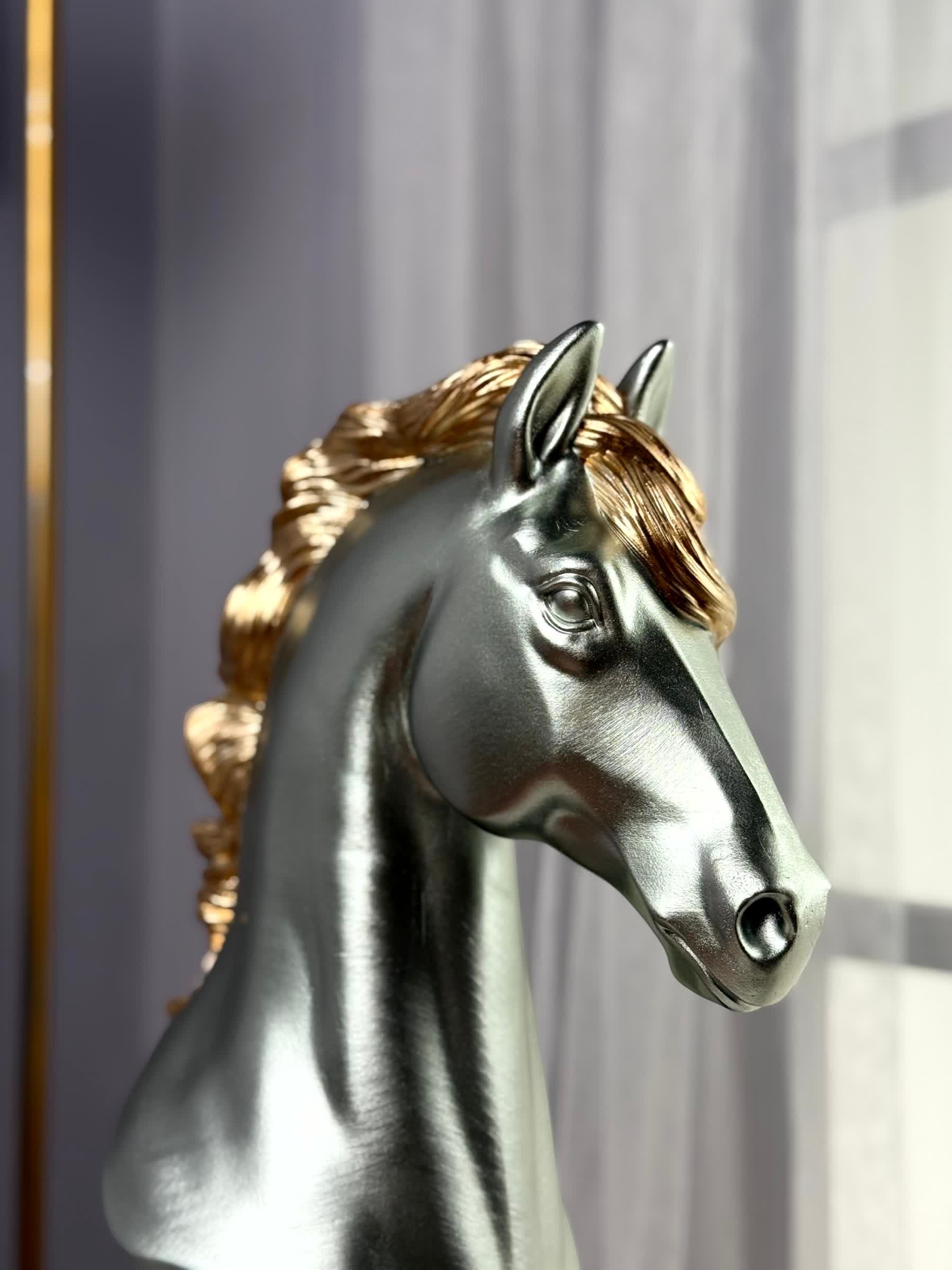 High Objects silver horse head showpiece with gold mane on black base. Polyresin decor.