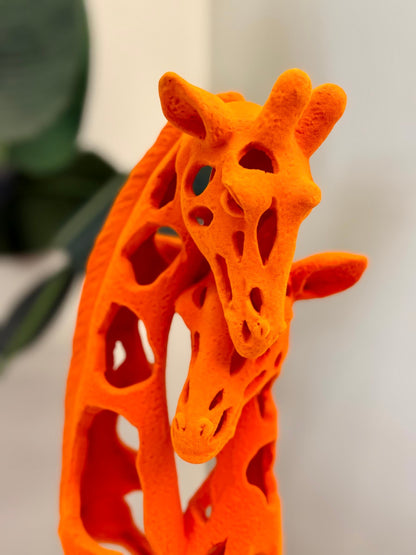 High Objects Savannah Embrace Showpiece, abstract matte terracotta-orange giraffe sculpture with cut-out design.