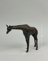 High Objects Savannah Grace polyresin giraffe showpiece, 8" tall, 11" wide, neutral tone with textured spots.