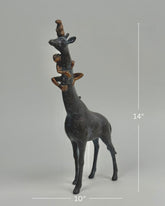 High Objects Savannah Majesty Showpiece sculpture of a giraffe with two monkeys on its head and neck, dark polyresin, 14" tall.