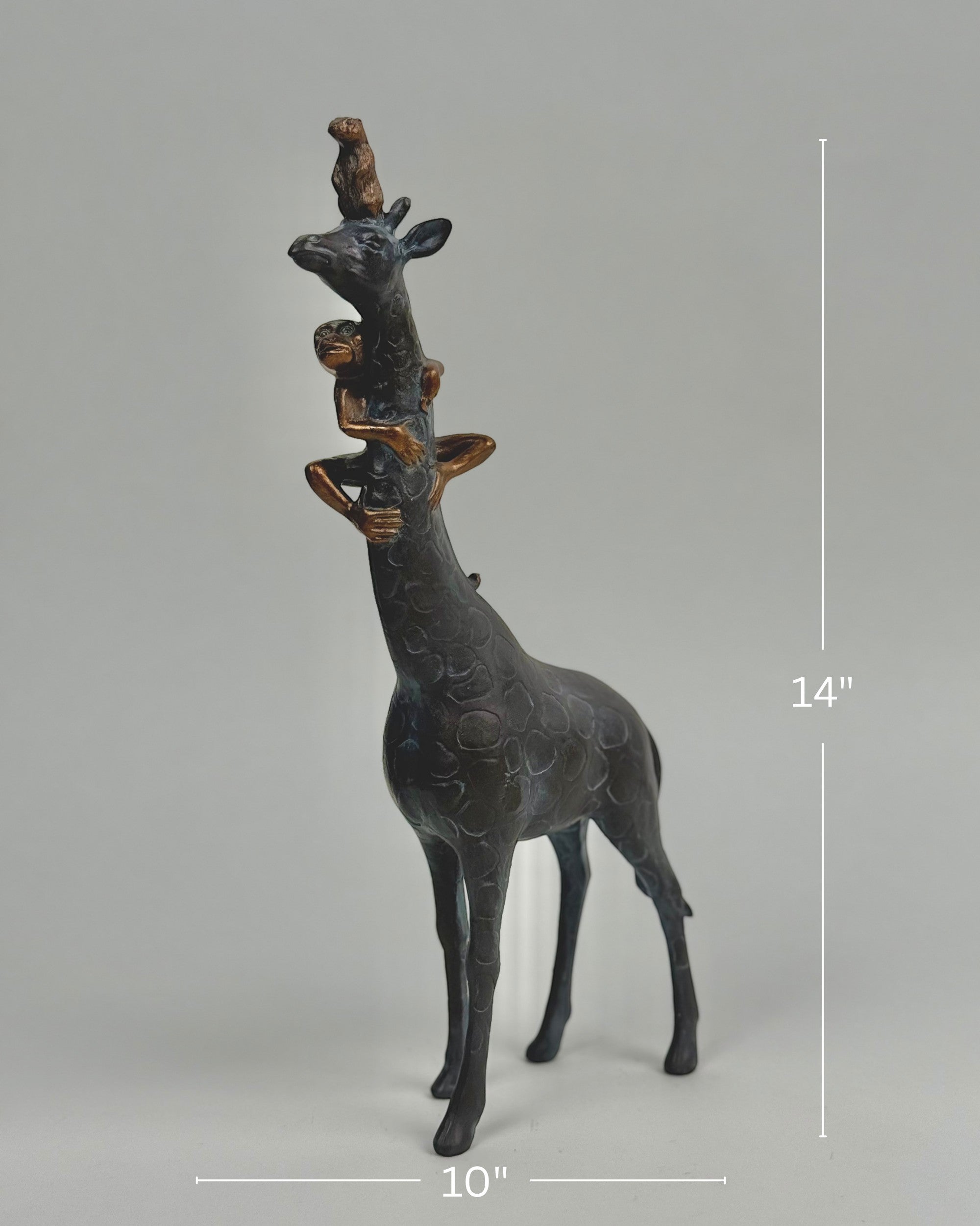 High Objects Savannah Majesty Showpiece sculpture of a giraffe with two monkeys on its head and neck, dark polyresin, 14" tall.