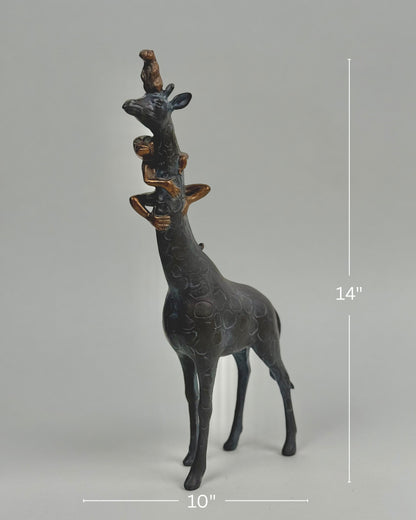 High Objects Savannah Majesty Showpiece sculpture of a giraffe with two monkeys on its head and neck, dark polyresin, 14" tall.