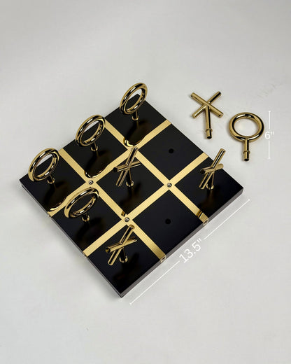 High Objects Sculpted Gold Tic-Tac-Toe Set with black MDF board and gold-finished iron X and O pieces.