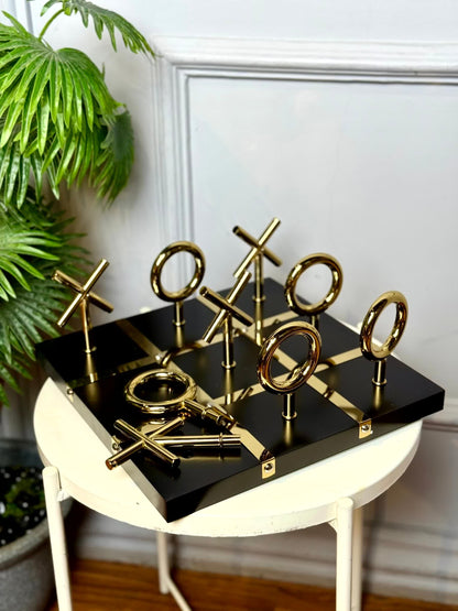 High Objects Sculpted Gold Tic-Tac-Toe Set with black MDF board and gold iron X and O pieces.