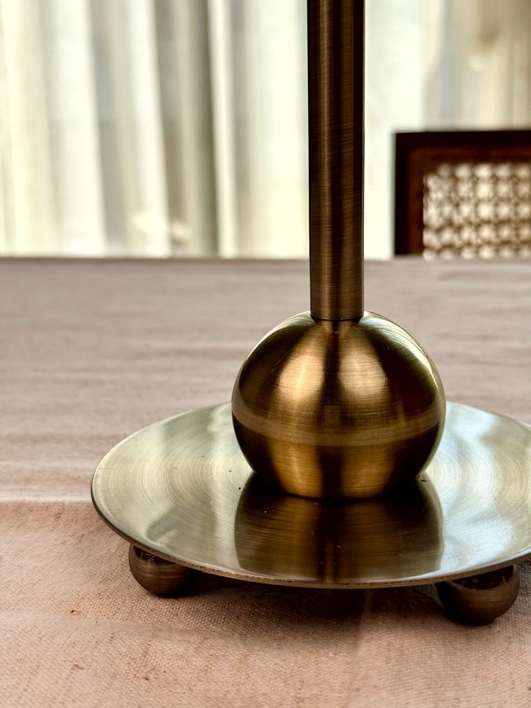 High Objects Seren Column Candle Stand Set, antique brass metal with sphere detail and wide base.