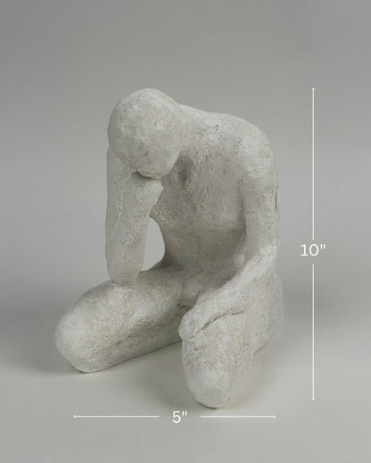 High Objects textured white polyresin showpiece of a faceless figure in a contemplative pose, 10" tall.