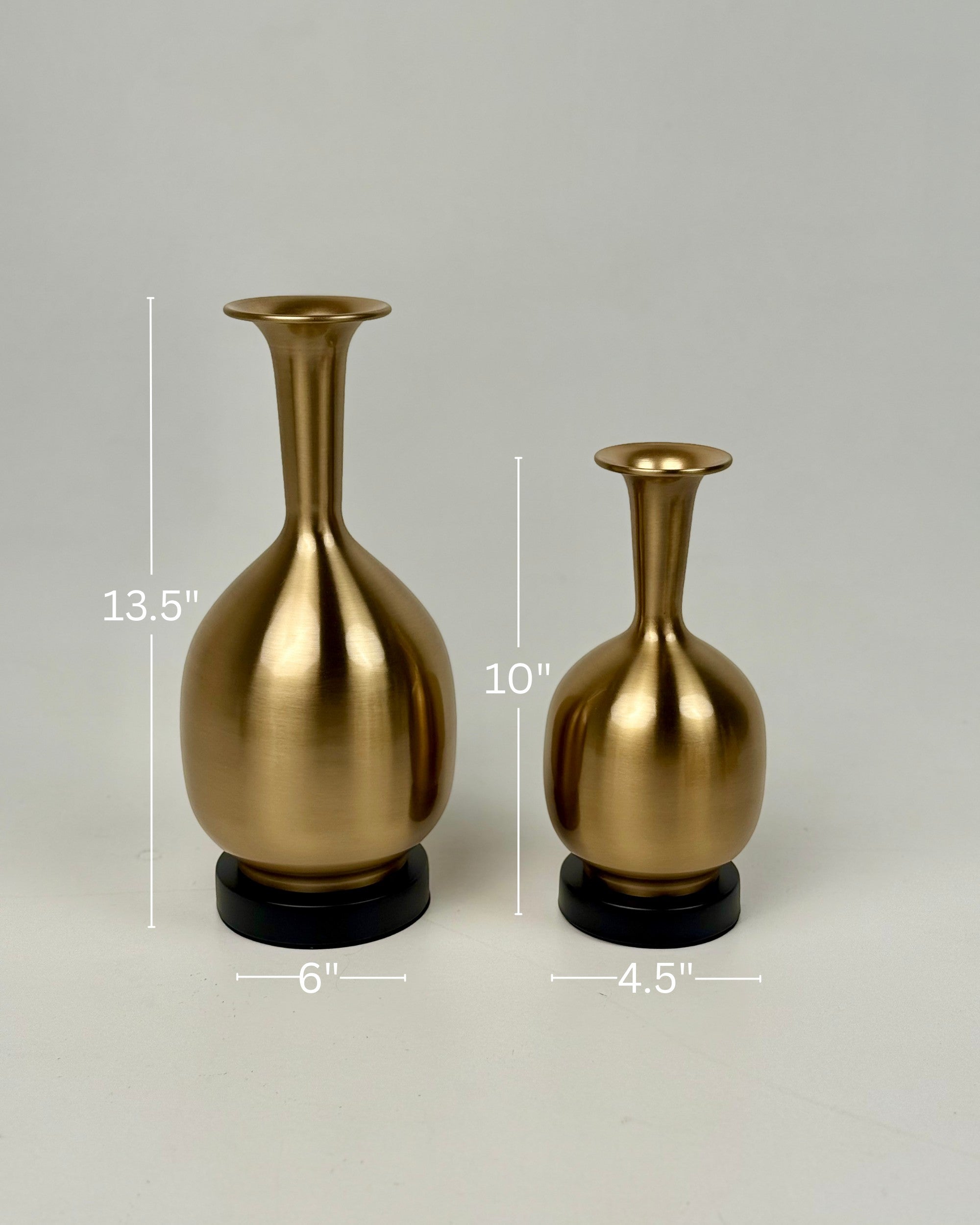 High Objects Solara Sculpted Vase, set of two gold metallic vases with rounded bodies and slender necks. One is 13.5" tall, the other 10" tall.