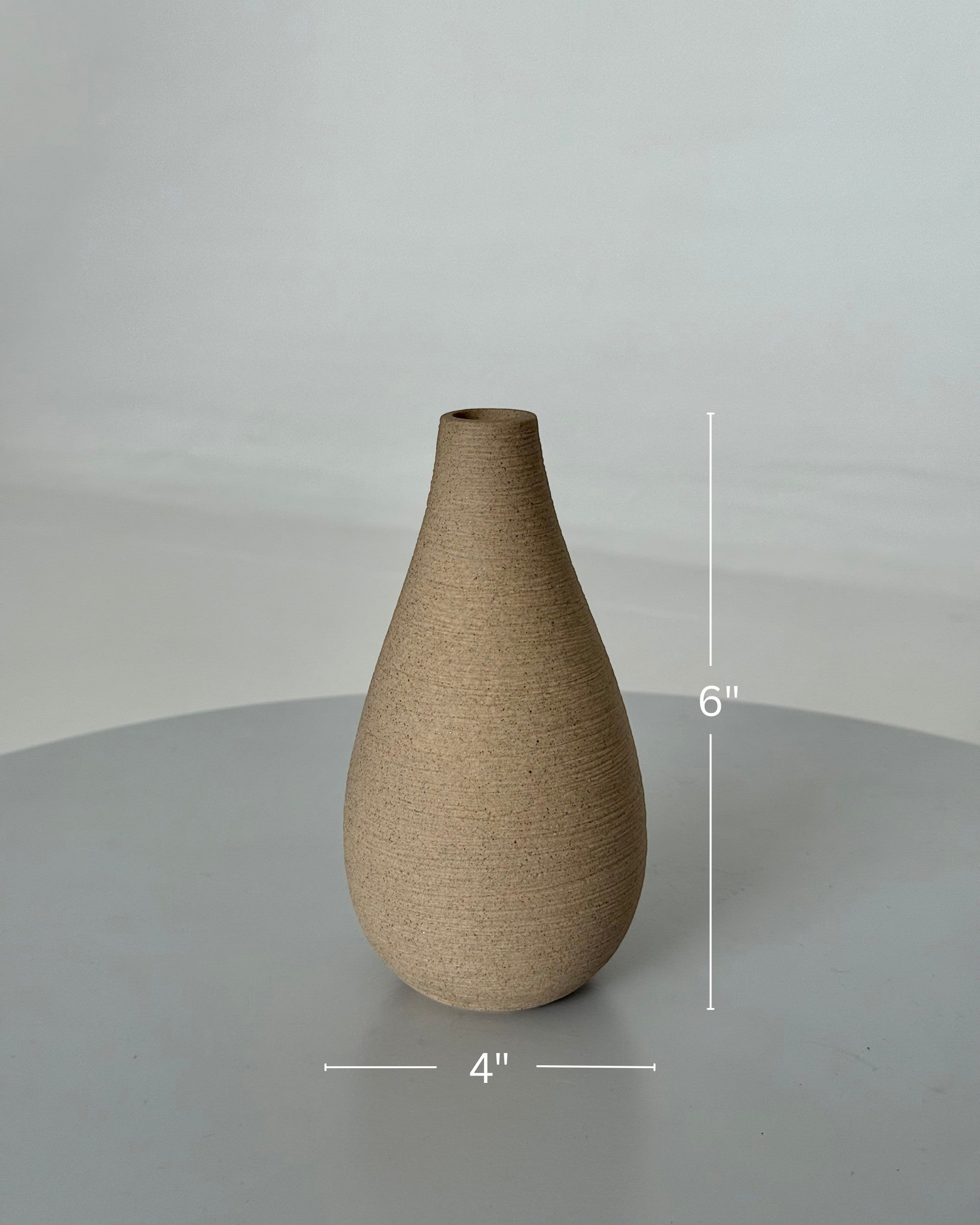 High Objects Solora teardrop vase, handcrafted natural clay with earthy texture, 6" tall.