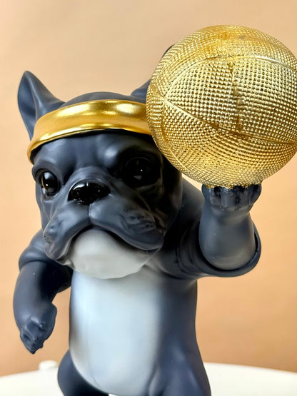High Objects Sport Bulldog showpiece in matte black and grey, holding a gold basketball and wearing a gold headband.