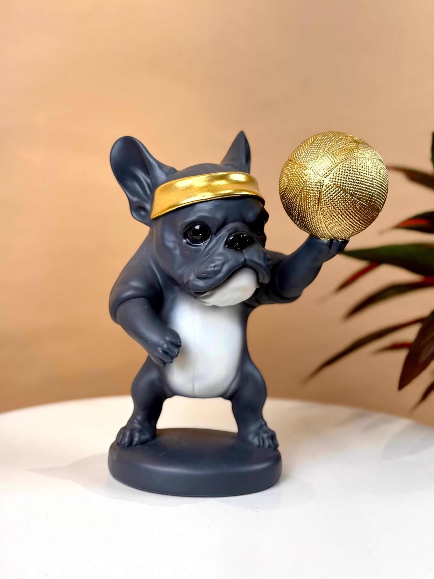 High Objects Sport Bulldog showpiece in matte black and grey, holding a gold basketball and wearing a gold headband.