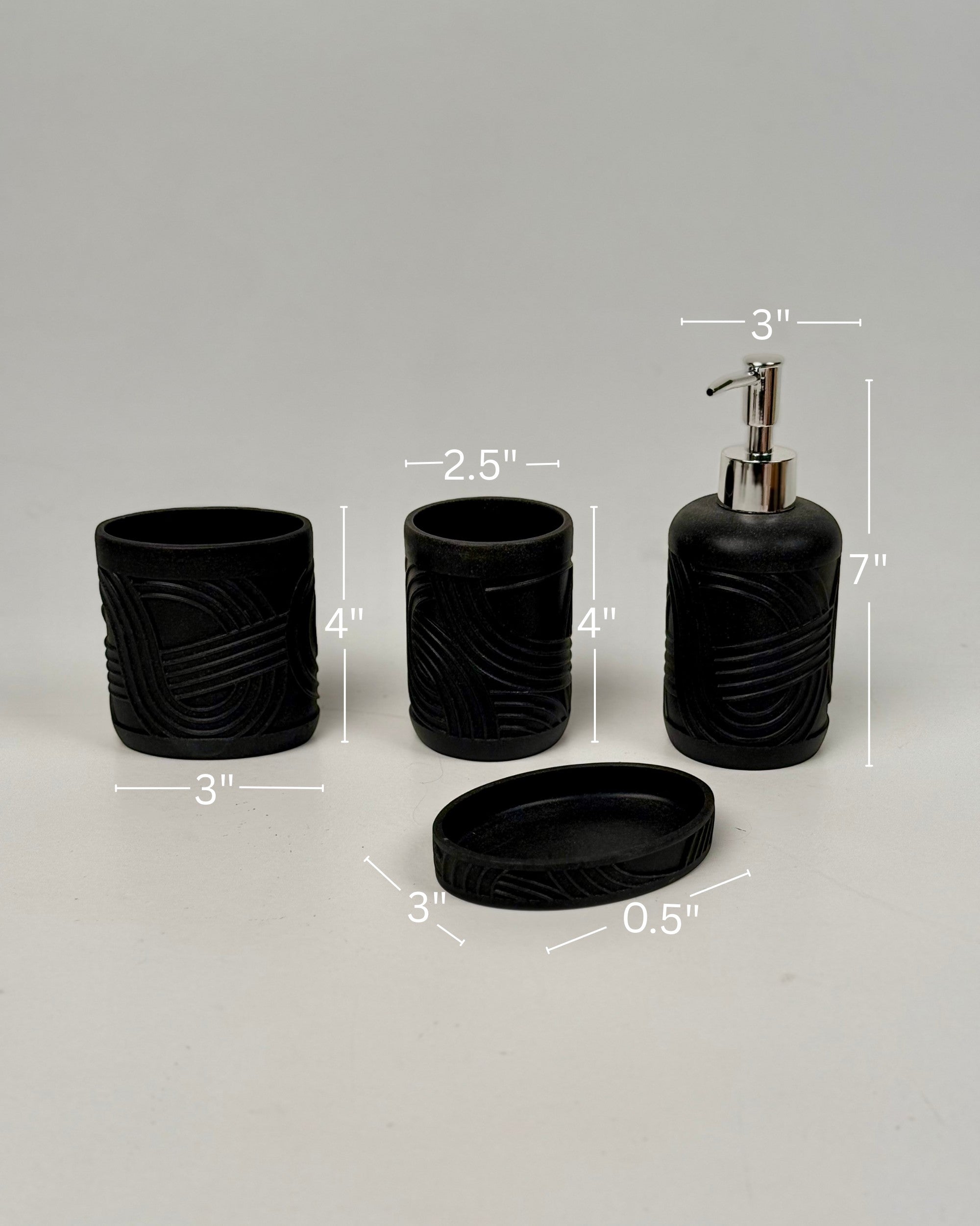High Objects Stratacurve black bathroom accessory set with textured grooves, includes soap dispenser, toothbrush holder, and soap dish.