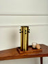 High Objects Studform Metal Vase, brushed brass cylinder with black studs, modern sculptural decor.