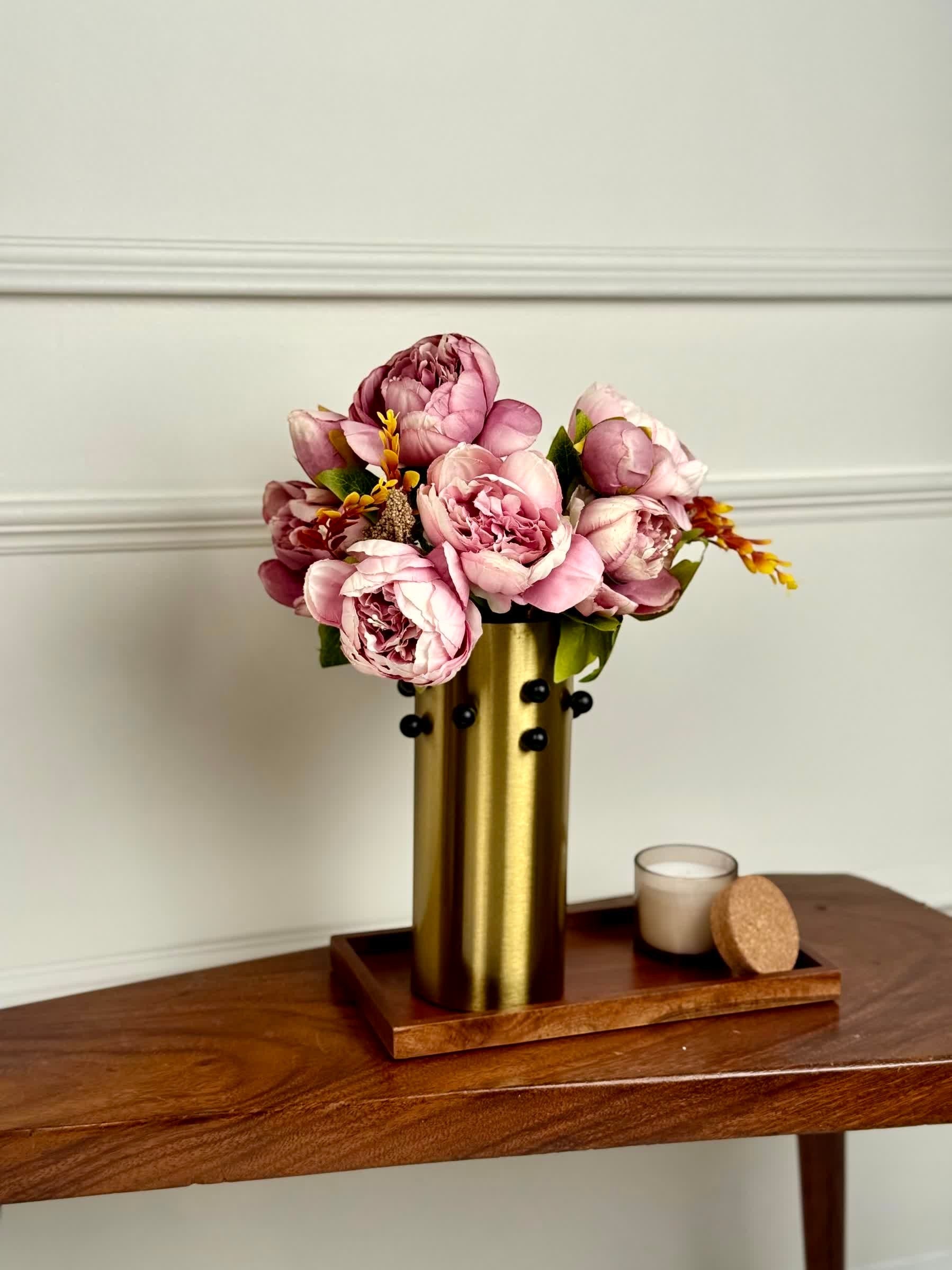 High Objects Studform Metal Vase, gold brushed metallic finish with rounded studs, holding pink peonies.