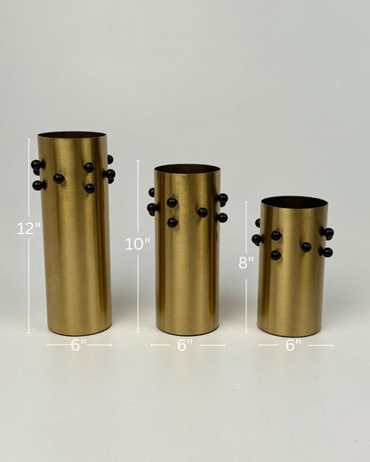 High Objects Studform Metal Vase set of 3, brushed gold finish with black studs, cylindrical shape, 12", 10", 8" heights.