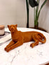 High Objects terracotta cheetah showpiece sculpture with carved detailing, resting on a marble surface.