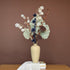 High Objects TerraForm Vase, a handcrafted beige ceramic vase with a matte texture, holding dried floral arrangement.