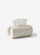 High Objects textured white rectangular tissue box holder on a marble countertop with soap and a towel.