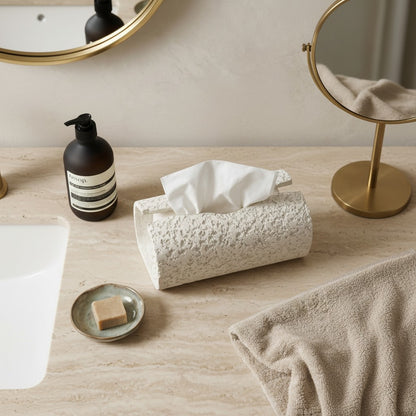 High Objects textured white rectangular tissue box holder on a marble countertop with soap and towel.
