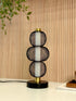 High Objects Trinity Slim Mesh Table Lamp with stacked black mesh spheres and brushed gold accents on a black base.