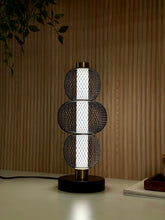 High Objects Trinity Slim Mesh Table Lamp with stacked black mesh spheres, brushed gold accents, and matte black base.