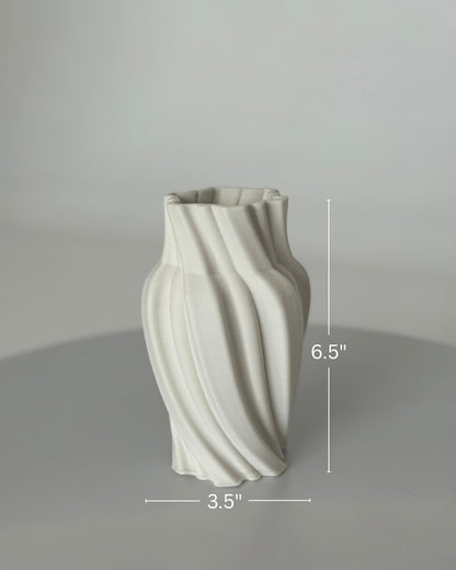 High Objects Volara Vase, white ceramic, 6.5" tall, 3.5" wide, with a twisting, fluid design.