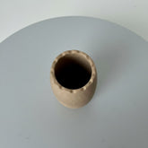 High Objects beige ceramic vase with wavy rim, 7" height, 3.5" diameter. Modern minimalist design.