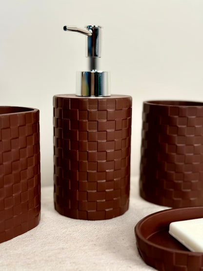 High Objects Weaveform bathroom accessory set in dark brown, featuring a woven texture. Includes soap dispenser, cups, and soap dish.