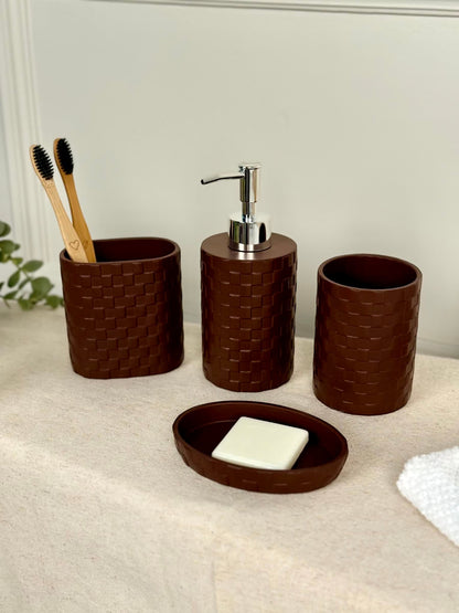 High Objects Weaveform Bathroom Accessory Set in dark brown, featuring a soap dish, soap dispenser, toothbrush holder, and cup with woven texture.